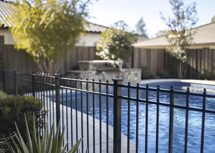 An aluminium pool fence built by Elite Fencing Redcliffe securing a backyard pool in North Brisbane