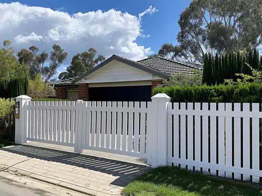 A white picket fence by Elite Fencing Redcliffe